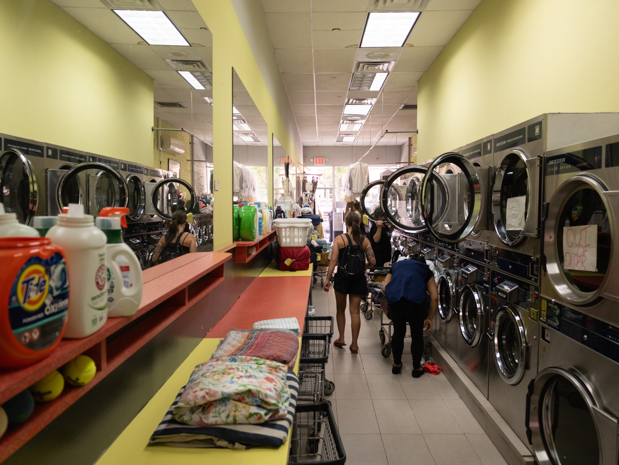 Inside Brooklyn Heights Laundry with customers doing laundry